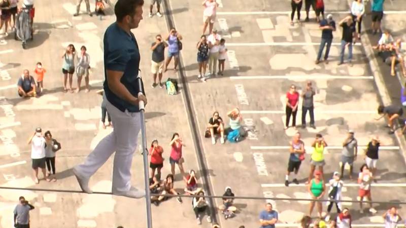 Daredevil Blake Wallenda walks on a highwire between two Ala Moana towers.