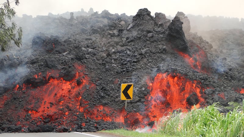 Lava crosses a roadway in lower Puna during the 2018 eruption. (Photo: USGS/HVO)