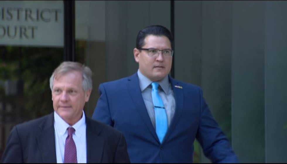 Derek Hahn and attorney Birney Bervar leave federal court