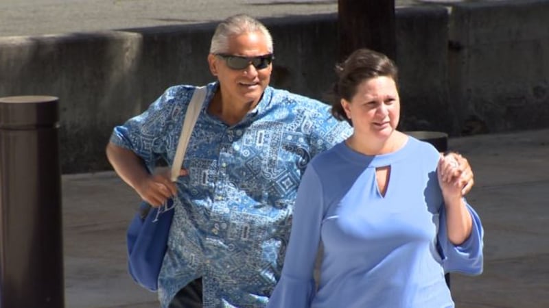 Former deputy city Prosecutor Katherine Kealoha and her husband, Louis, walk into the federal...