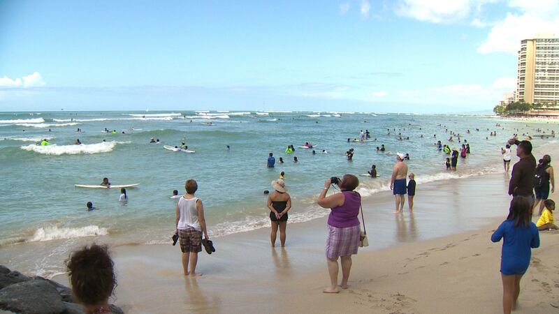 Twenty-eight families headed to Kuhio Beach to participate in a carefree day of surfing and...