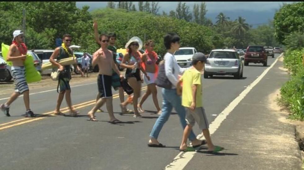 Pedestrians walking across the street