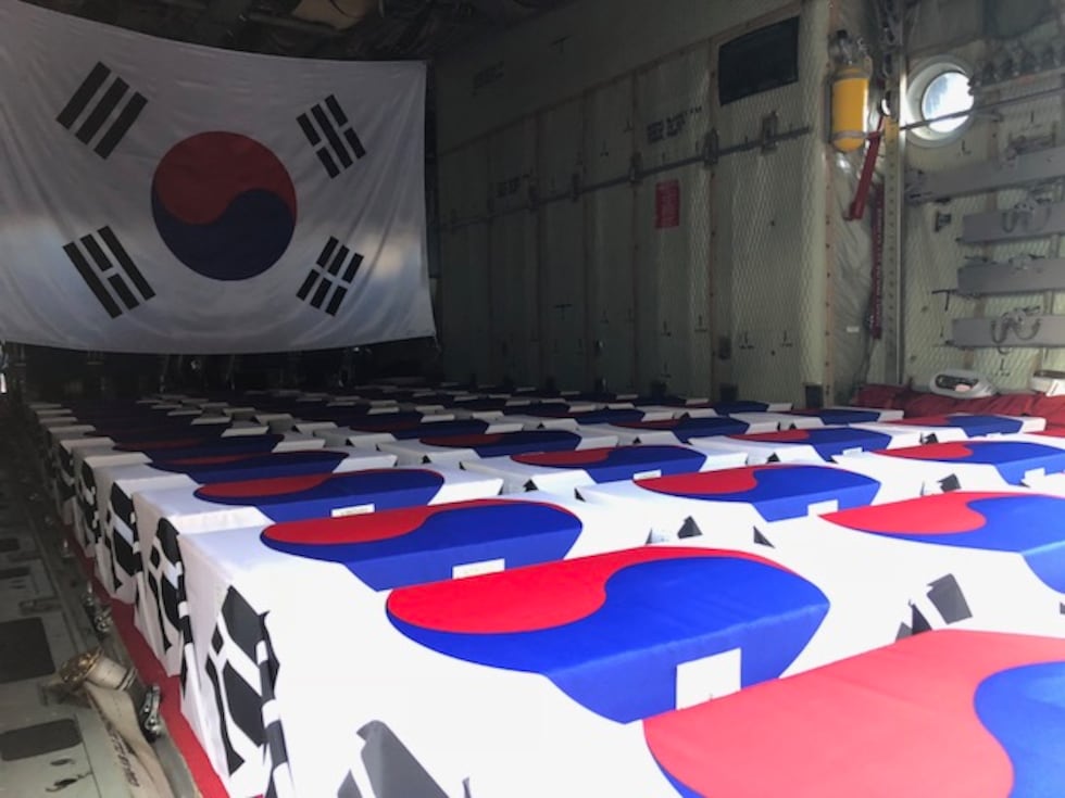 Boxes holding skeletal remains of South Korean soldiers killed during the Korean War line the...