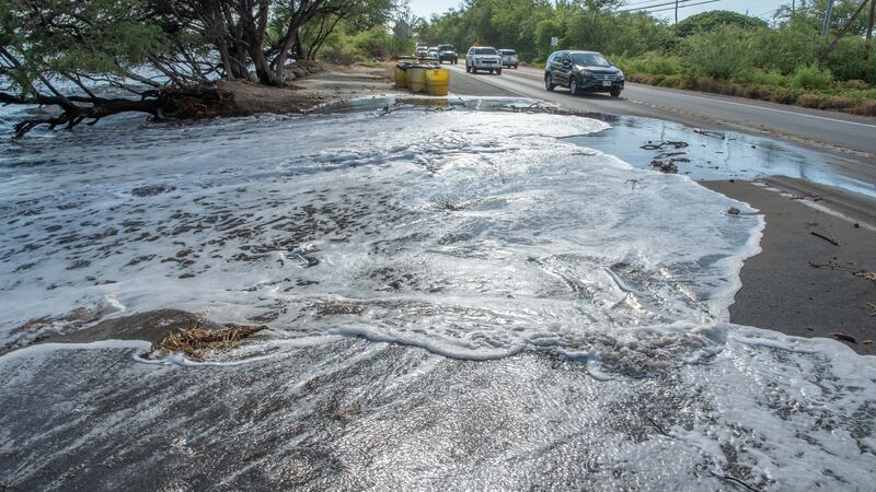 Waves wash onto Honoapiilani Highway on Maui..