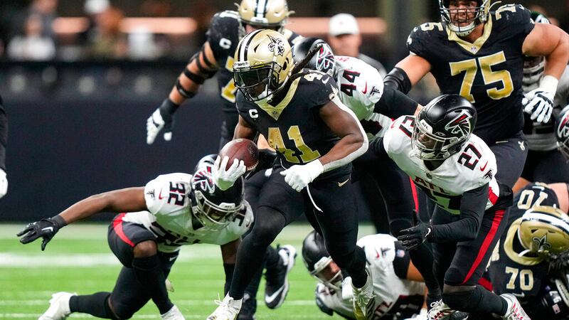 New Orleans Saints running back Alvin Kamara (41) runs in front of Atlanta Falcons safety...