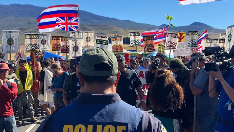 Native Hawaiian activists gathered at the base of Mauna Kea on Monday to protest the start of...