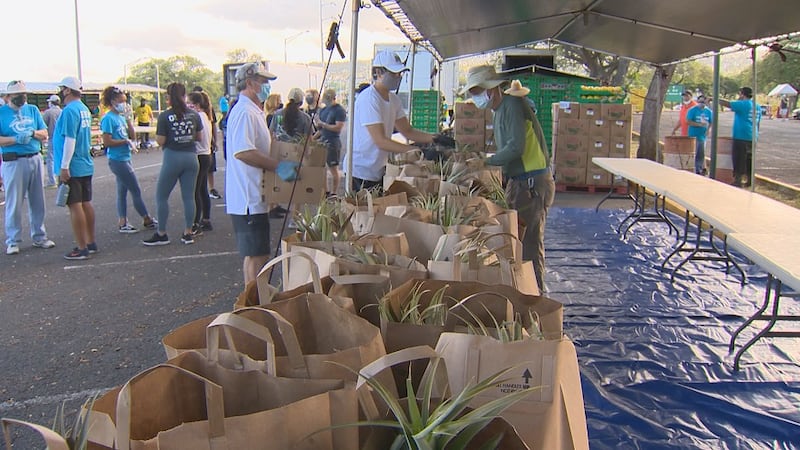 Volunteers helped out at a food distribution event at Aloha Stadium on Wednesday, May 6.