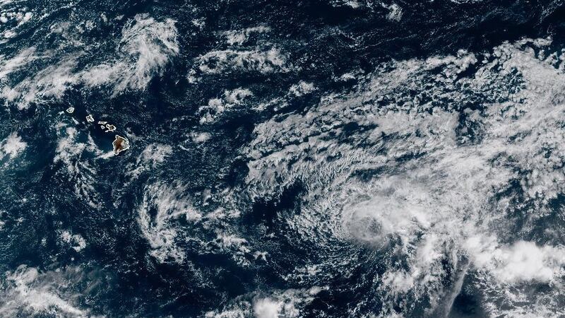 Tropical Depression Twelve-E is seen as a swirl of clouds to the east of Hawaii.
