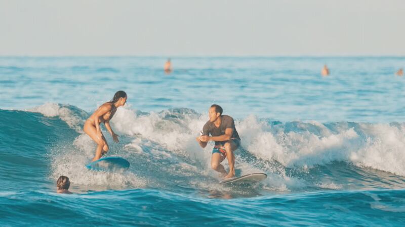 Chris Garth and Lauren Oiye got engaged this past weekend in the waters off Waikiki.