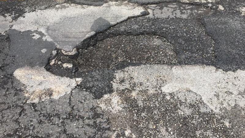 A giant pothole sidelined cars in the Zipper lane on Monday morning.
