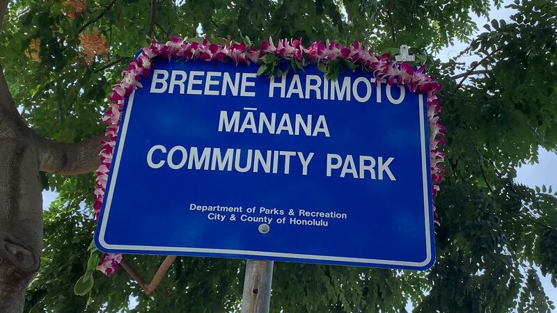 One of the new signs were draped in lei after the unveiling Monday.