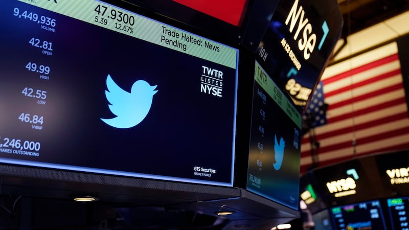 The symbol for Twitter appears above a trading post on the floor of the New York Stock...
