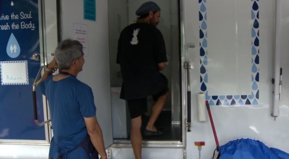 Bryan Wells was able to get a warm shower in a mobile unit parked outside Kaneohe library on...