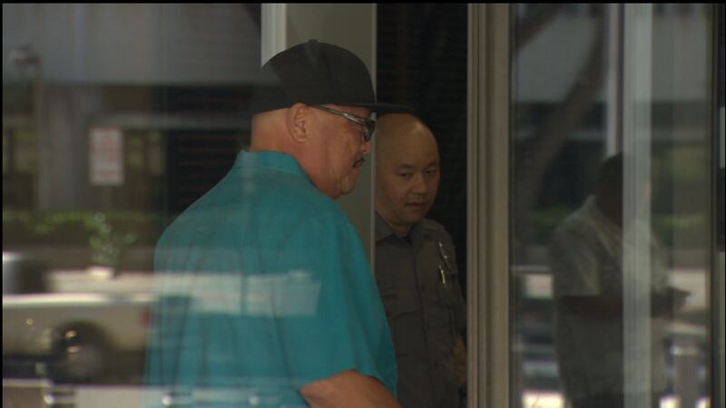 Former ILWU official Nate Lum leaves the federal court house today after he was sentenced to...